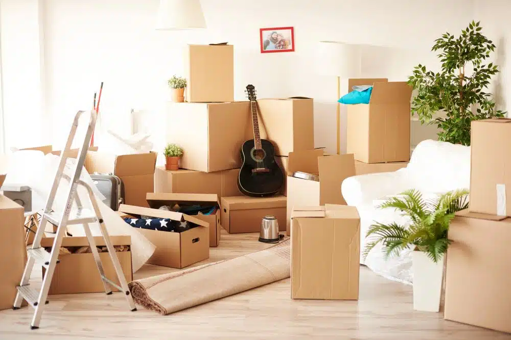 Cluttered room filled with moving boxes.